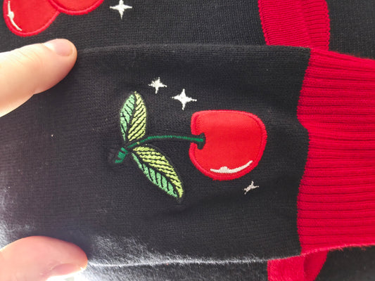 Embroidered Cherry details on cuff of arm on the cardigan