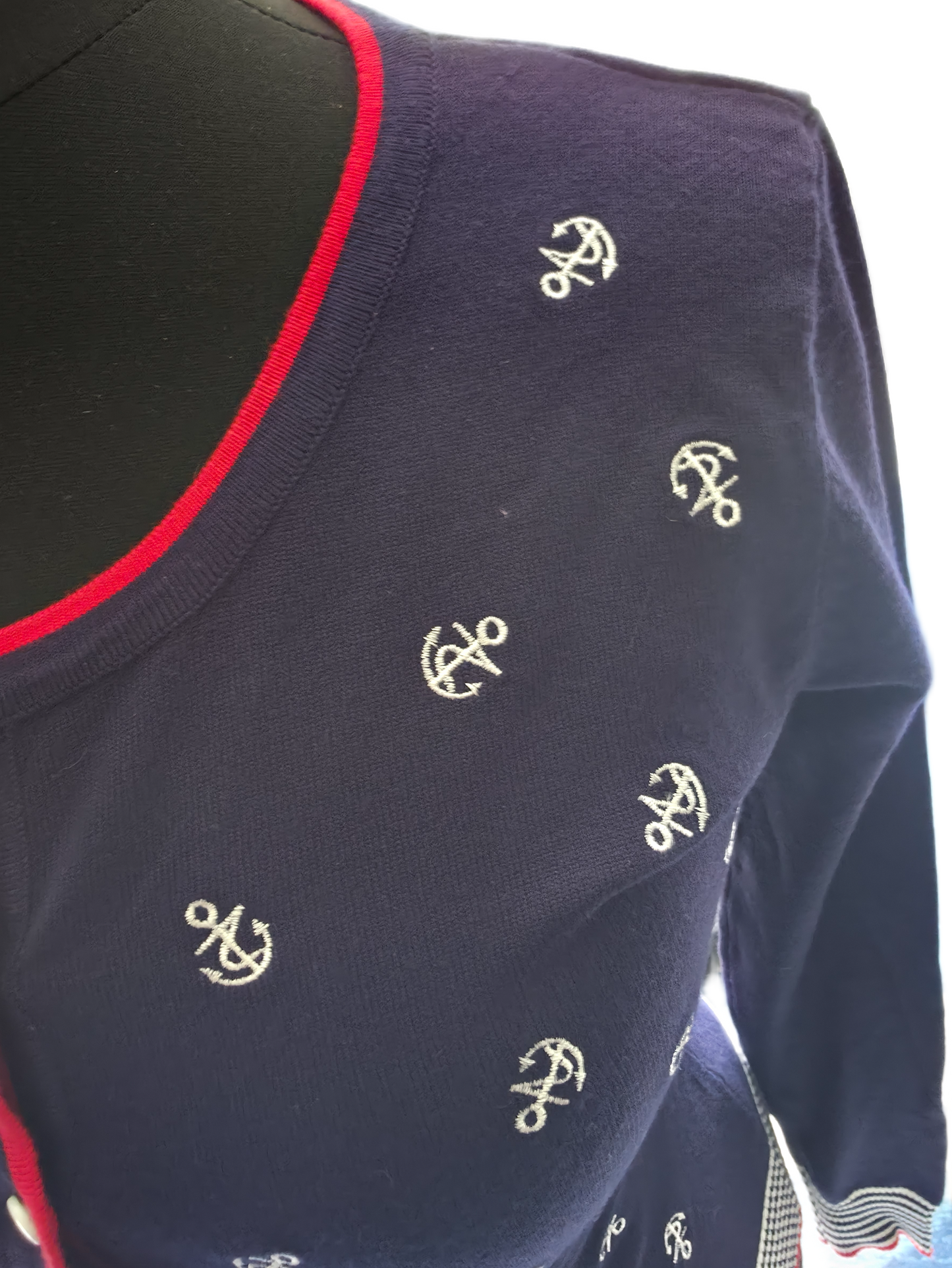 Details of the embroidered anchors on the cardigan