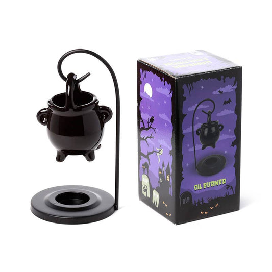 Black oil burner with packaging featuring a Halloween theme on a white background