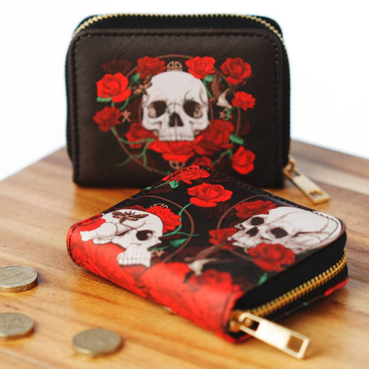 Black wallet with skull and rose design on a wooden surface